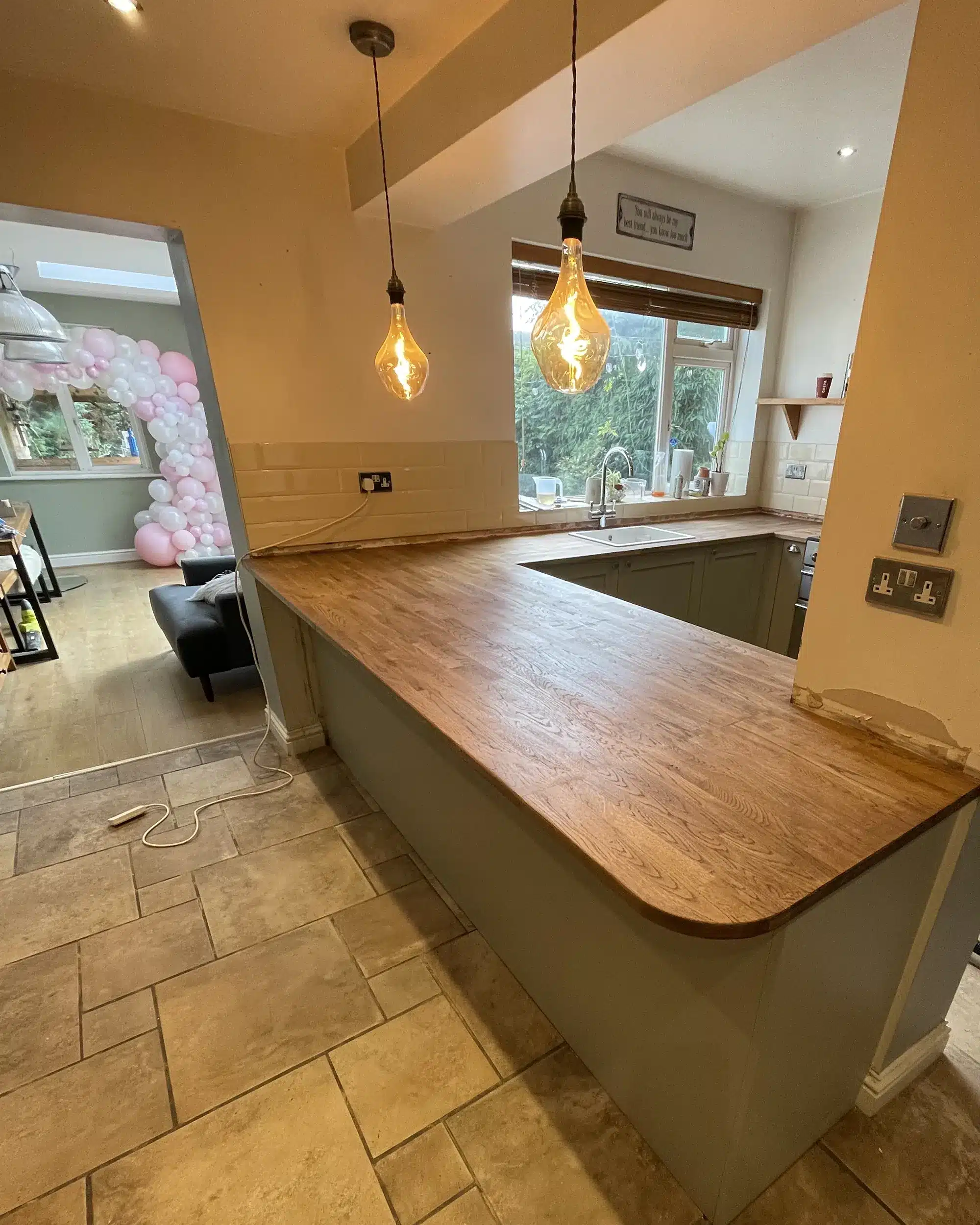 kitched-tiled-floor-wooden-work-surfaces